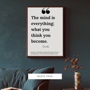 May include: A white framed print with a black quote that reads "The mind is everything; what you think you become." The quote is attributed to Socrates. Below the quote is a smaller text that reads "Actually, the stomach is everything. What you eat, you become. So eat pizza, be pizza, simple as that."