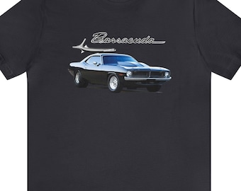 May include: Dark navy t-shirt featuring a classic black Barracuda muscle car graphic. The car is depicted with silver accents and white wheels, and the word "Barracuda" is written above the car in a stylized font.
