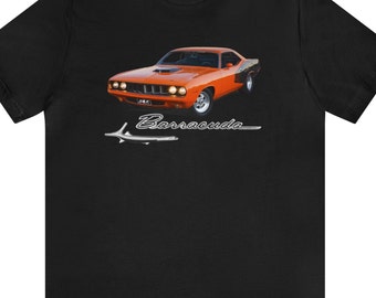 May include: Black t-shirt featuring an orange classic car graphic. The car is a Barracuda with the name printed below the car in a stylized font. The shirt is made of a soft, comfortable material.