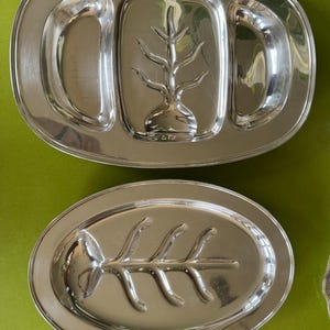Silver service serving dishes.