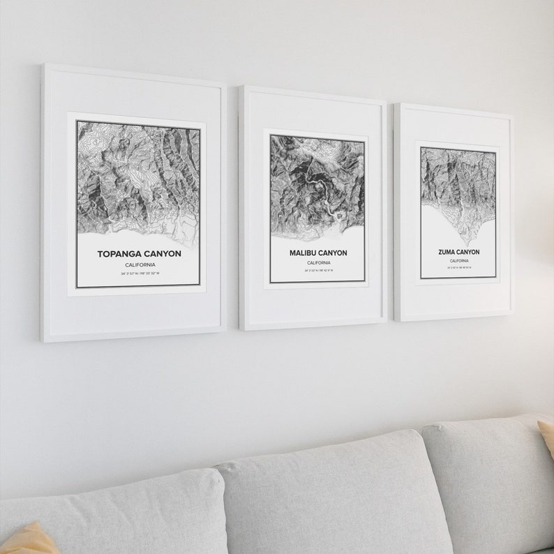 May include: Three framed black and white topographic maps of Topanga Canyon, Malibu Canyon, and Zuma Canyon in California.