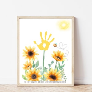 May include: A printable art print featuring a yellow handprint surrounded by yellow sunflowers and a small bee. The text at the bottom reads "Be the strongest, tallest, brightest bloom in the field."