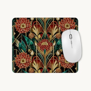 May include: A rectangular mouse mat featuring a repeating pattern of red flowers, teal leaves, and gold geometric lines on a black background. A white computer mouse with a scroll wheel is positioned on the right side of the mouse mat.