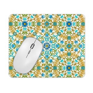 May include: A white computer mouse with a blue and yellow floral pattern mouse mat. The mouse mat has a repeating pattern of stylised flowers and leaves.