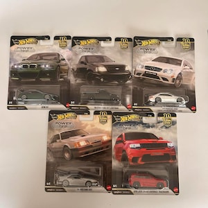 May include: Six Hot Wheels die-cast model cars on their original packaging. The cars include a green BMW M3, a black Ford F-150 SVT Lightning, a white Mercedes-Benz CLK 63 AMG Black Series, a silver '94 Mustang SVO, and a red 2018 Jeep Grand Cherokee Trackhawk.