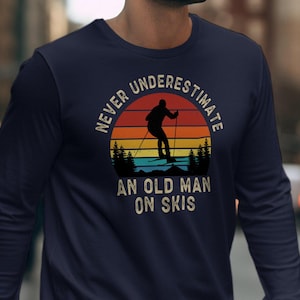 Never Underestimate an Old Man on Skis Sweatshirt, Retro Skiing Trip Long Sleeve Shirt Men, Womens Ski Clothes Funny Snow Skier Gift for Him