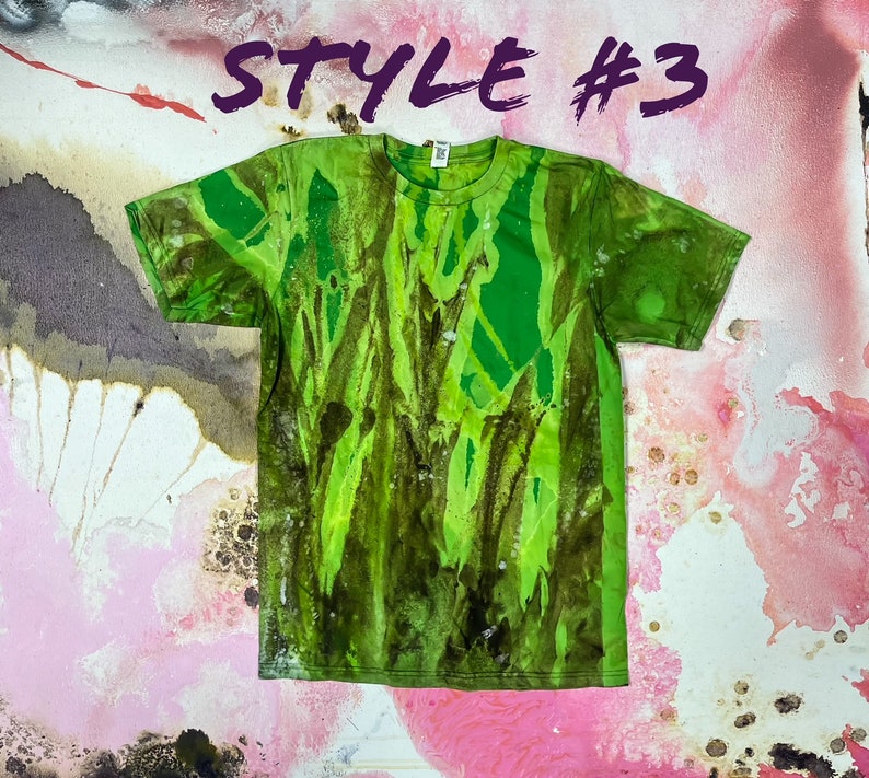 May include: Green and brown tie-dye t-shirt with a faded, abstract pattern. The shirt has a crew neck and short sleeves. Style #3.