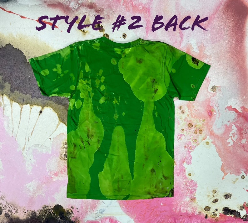 May include: Green t-shirt with a tie-dye pattern. The back of the shirt has a green, brown, and white pattern. The shirt is labeled "Style #2 Back".