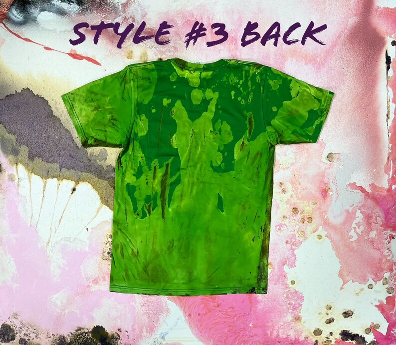 May include: Green t-shirt with a tie-dye pattern. The back of the shirt has a green, brown, and yellow pattern. "Style #3 Back" is written in purple on the top of the image.