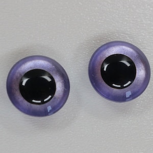 May include: Two purple and black plastic safety eyes with a shiny finish. The eyes are round and have a black pupil with a white ring around it.