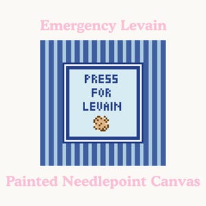 May include: A painted needlepoint canvas with the text "Emergency Levain" in pink above a blue and white striped background. A light blue square in the center reads "PRESS FOR LEVAIN" with a pixelated cookie image.