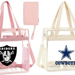 May include: Two clear tote bags with a zippered pouch. The pink bag has a black and white Raiders logo. The beige bag has a blue and white Cowboys logo.