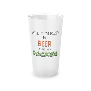 May include: White frosted glass with the text "ALL I NEED is BEER AND MY DOCKER" in black, orange, and green.