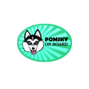 May include: A green oval sticker with a cartoon husky dog and the text "POMSKY ON BOARD".