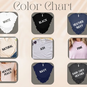 May include: Color chart showing different t-shirt colors, including white, black, heather navy, natural, ash, pink, heather peach, navy, and dark grey heather.