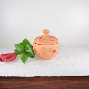 May include: A set of three ceramic mugs with a speckled, matte finish. The mugs are in shades of cream, light gray, and dark gray. Each mug has a simple, minimalist design, perfect for coffee or tea.