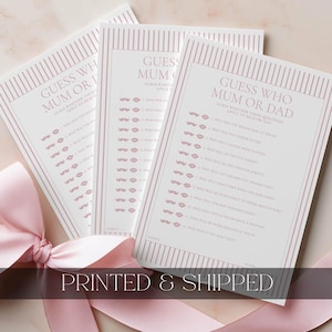 May include: Three white game cards with pink vertical stripes and text reading Guess Who Mum or Dad. Each card features a list of questions with pink lip and moustache icons next to each line. A light pink ribbon is tied around the base of the cards.