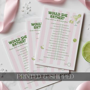 May include: Three rectangular game cards with a light pink and white vertical striped background. The text reads WOULD SHE RATHER? Guess which one the bride prefers? followed by a list of choices with heart icons, lime illustrations, and a score circle.