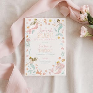 May include: A mermaid-themed birthday party invitation with the text "Splish Splash! It's a mermaid bash!" and "Evelyn's 3rd Birthday!" in pink and green. The invitation features illustrations of mermaids, sea creatures, and floral accents.