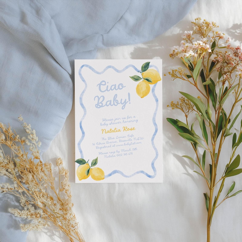 May include: A baby shower invitation with the text "Ciao Baby!" in light blue script. The invitation features watercolor lemons and a blue border. The invitation includes details for Natalia Rose's baby shower.
