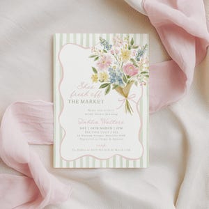 Peut inclure: Une invitation florale avec un bouquet de fleurs roses, jaunes et bleues &agrave; l'aquarelle. La carte a un fond ray&eacute; et le texte "She's fresh off the market" et les d&eacute;tails d'une f&ecirc;te pr&eacute;nuptiale.