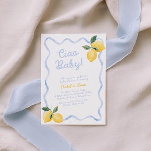 May include: Baby shower invitation with the text "Ciao Baby!" in light blue script. The invitation features watercolor lemons and a blue wavy border. The invitation is on a white background with a light blue ribbon.