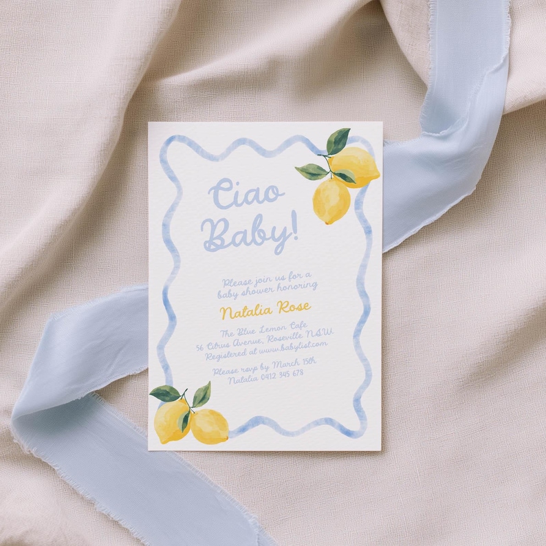 May include: Baby shower invitation with the text "Ciao Baby!" in light blue script. The invitation features watercolor lemons and a blue wavy border. The invitation is on a white background with a light blue ribbon.