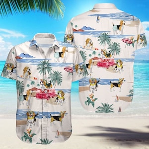 May include: A white button-down shirt with a beach scene pattern. The pattern features palm trees, ocean waves, and beagles wearing sunglasses and hats. The beagles are in various poses, including surfing, driving a van, and relaxing on the beach.