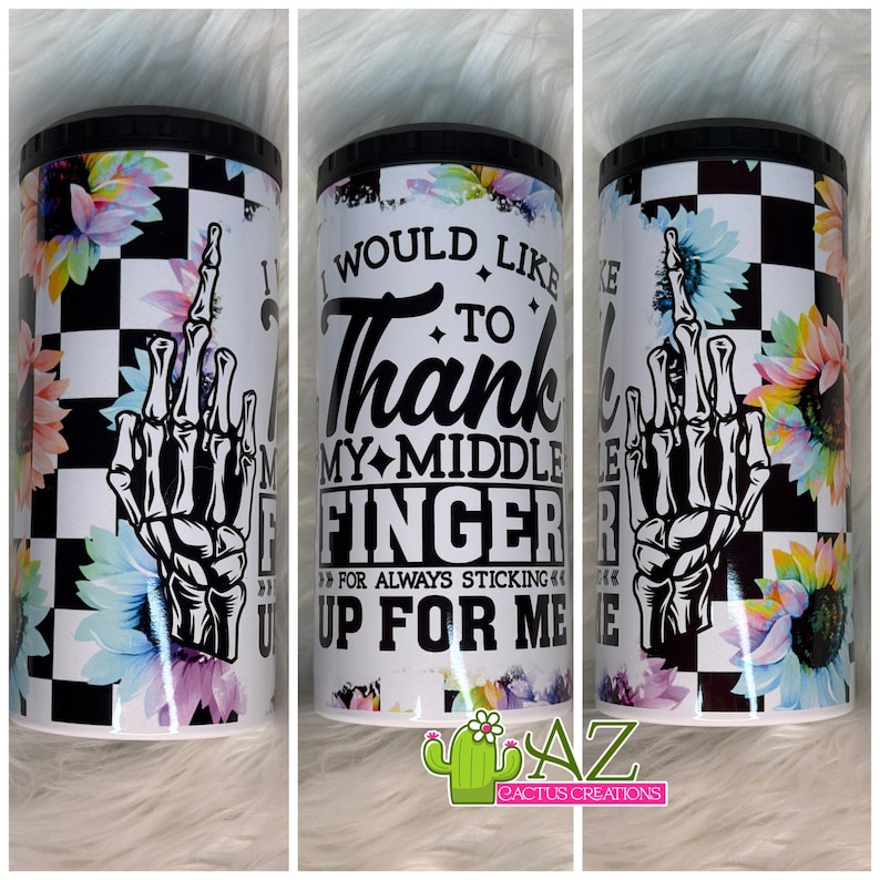 May include: A white tumbler with a black lid features a black and white checkered pattern, floral accents, and a skeleton hand giving the middle finger. Text reads "I would like to thank my middle finger for always sticking up for me."