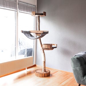 TOMCAT Lounge Tower - A minimalist cat tree made of driftwood - designed as a quiet retreat and elevated lounging structure.