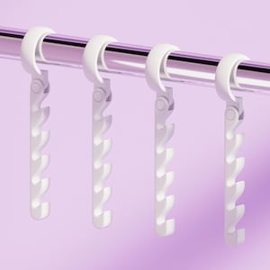 May include: A set of three ceramic mugs with a speckled, matte finish. The mugs are in shades of cream, light gray, and dark gray. Each mug has a simple, minimalist design, perfect for coffee or tea.