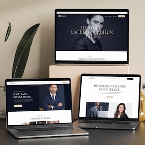 May include: Three laptops displaying website designs. The top laptop shows a woman in a suit with text. The bottom left laptop displays a man in a suit with text. The bottom right laptop displays a business coaching consultant website.