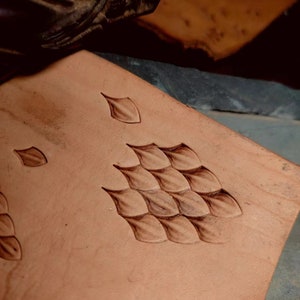 Reptile texture leather embossing result on brown leather