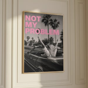 Not my problem poster with pink typography and retro aesthetic
Sassy quote wall art with bold pink text and vintage photo
Trendy typography print for modern room decor
Motivational attitude poster for girl room or bedroom
Aesthetic quote wall art with black and white background
Stylish statement poster for modern home decor