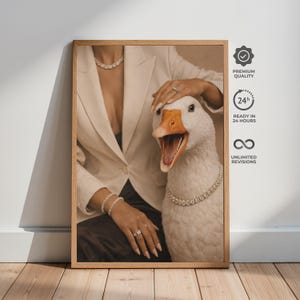 May include: A framed print featuring a goose wearing a diamond necklace. The goose is positioned next to a person wearing a white blazer and jewelry. The print has text that reads "Premium Quality", "Ready in 24 Hours", and "Unlimited Revisions".