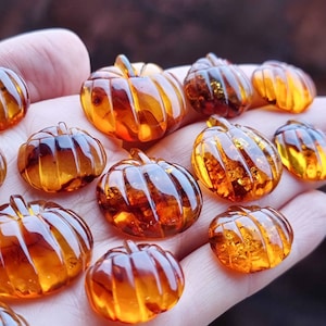 Natural Baltic Amber Carved Pumpkin Cognac Color, Free Shape Flat Bottom Cabochons, Various sizes.