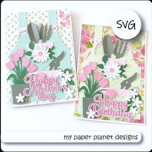 May include: Two handmade greeting cards with a garden theme. One says "Happy Mother's Day" and the other says "Happy Birthday". Each card features a light green apron design with pink tulips, white daisies, and gardening tools.