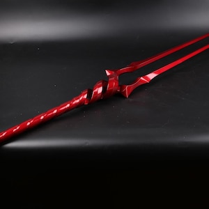 May include: A red, twisted, metal spear with a double-pronged tip.