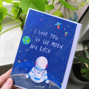 Karte mit Liebesgruß Astronaut auf dem Mond