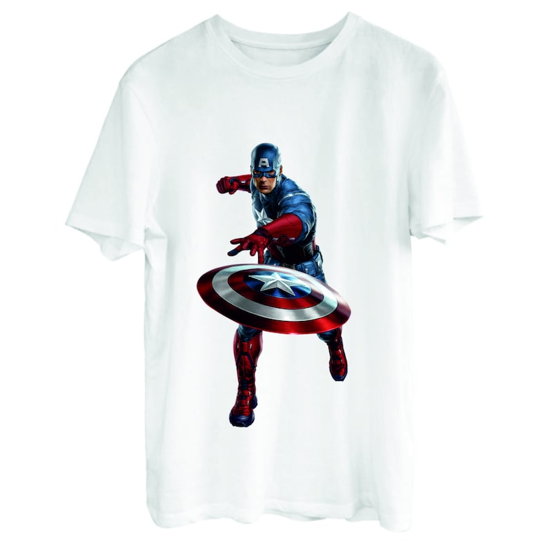May include: White t-shirt with a printed image of Captain America throwing his shield. The shield is red, white, and blue with a star in the center. Captain America is wearing a red, white, and blue costume.
