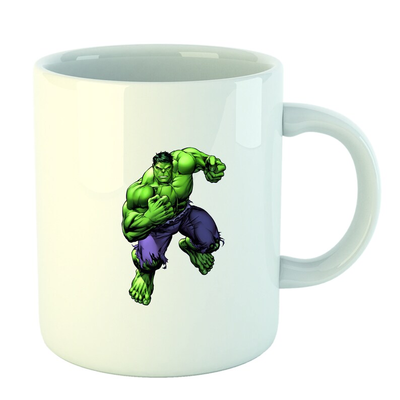 May include: White ceramic mug with a green and purple illustration of the Hulk, a superhero character, in a fighting pose.