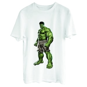 May include: White t-shirt with a green Hulk graphic print. The Hulk is depicted in a muscular pose with his fists clenched.