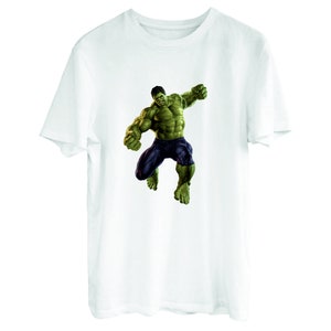 May include: White t-shirt with a green Hulk graphic. The Hulk is depicted in a dynamic pose, with his fists clenched and his face contorted in a fierce expression.