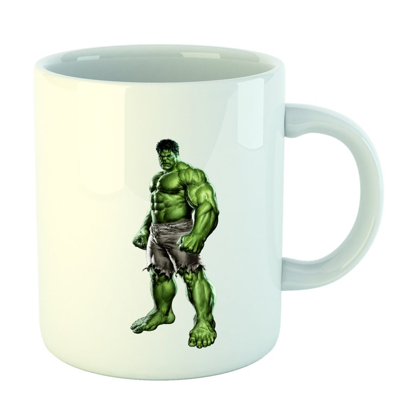 May include: White ceramic mug with a green and purple illustration of the Hulk, a superhero character, on the front.