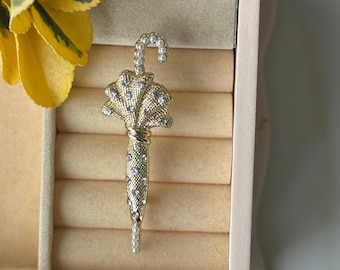 Broche de paraguas brillante: elegante broche para la lluvia, un accesorio chic para abrigos y bolsos.