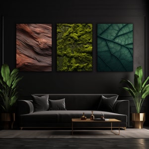 May include: Three framed abstract art prints with nature-inspired designs. The prints are hung on a black wall above a black velvet sofa. The prints feature a close-up of wood grain, green moss, and a green leaf.