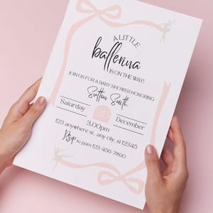 May include: A pink and white baby shower invitation with a pink ribbon and bow design. The text reads "A Little Ballerina is on the way!" and includes the date, time, and location of the event.
