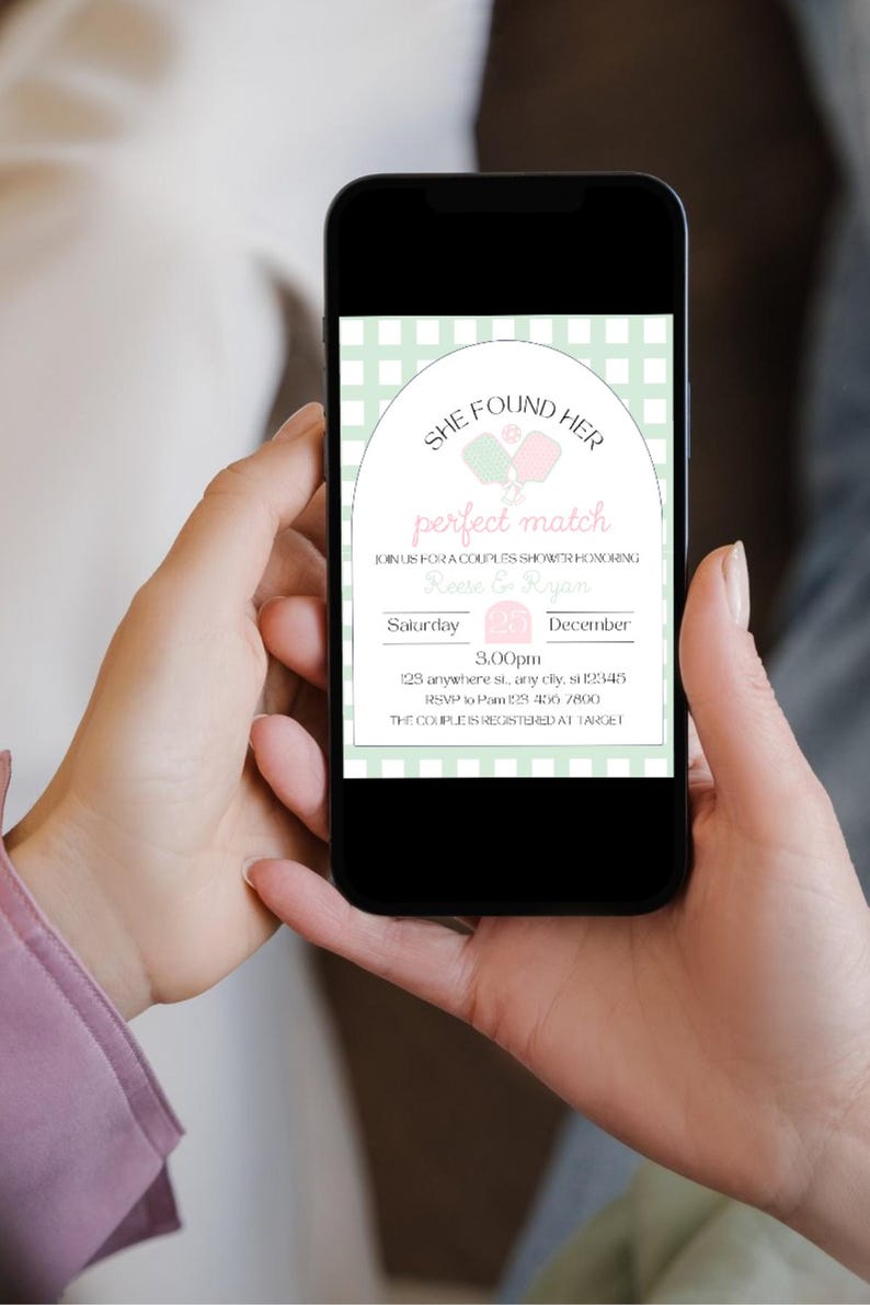May include: A smartphone displays a couples shower invitation. The invitation features the text "SHE FOUND HER perfect match" with pink and green accents. Details include the date, time, and RSVP information.