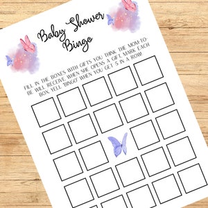 May include: Baby shower bingo game sheet with a butterfly theme. The white paper has a grid of blank boxes for guests to fill in. The text reads "Baby Shower Bingo" and instructions. Watercolor butterflies in pink and purple decorate the top and bottom.