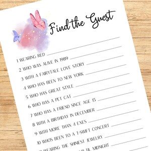 May include: A white paper with the text "Find the Guest" in cursive script. The top left corner features watercolor butterflies in pink and blue. The game includes fill-in-the-blank prompts such as "Wearing Red" and "Who Has a Pet Cat."